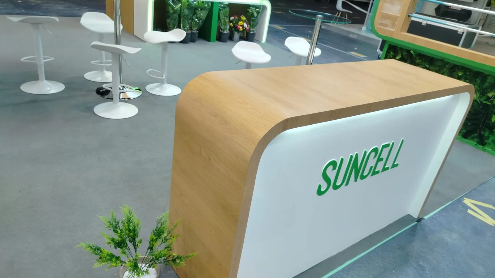 Curved reception counter on the Suncell stand at JEC World 2026, Paris