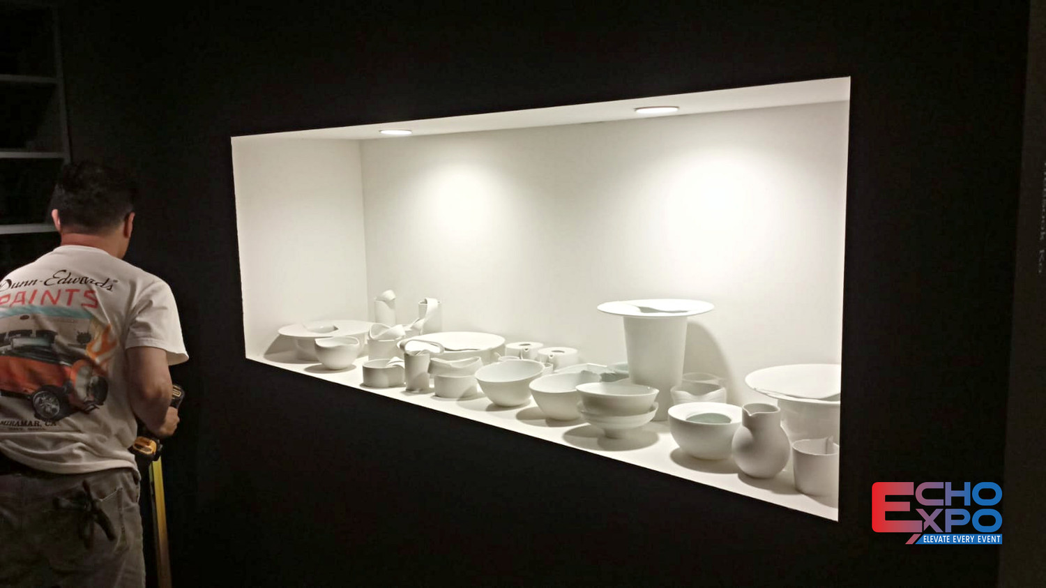 Angled white display plinth holding turned wooden vessels under directional lighting at the KCDF exhibition, Rossana Orlandi Gallery, Milan 2024.