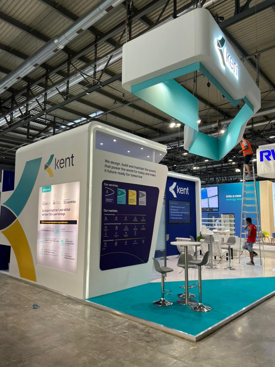 Suspended curved sign board above a 63 sqm oil and gas exhibition stand at Gastech, Fiera Milano, September 2022